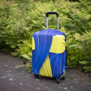 Komplet pokrowców na walizkę S,M,L - wzór żółto-niebieskie pasy Zestaw 3 sztuk.